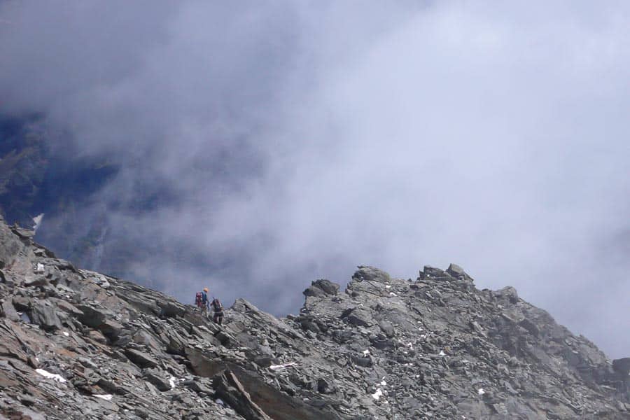 New Zealand Mountain Guide and Climber Descending the North West Ridge of Mt Aspiring
